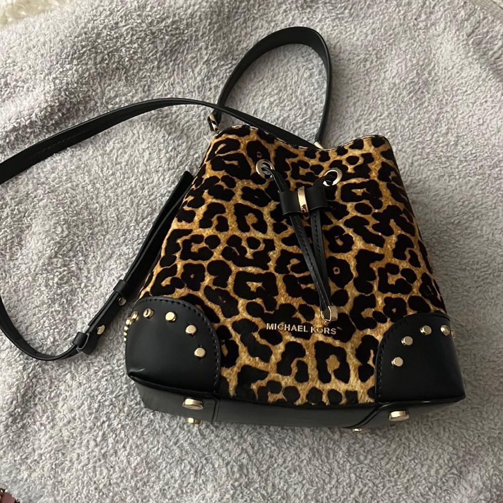 Michael Kors cheetah print bucket bag.
